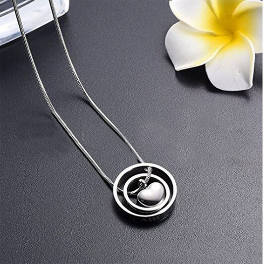 Heart-shaped urn necklace with pawprint memorial design