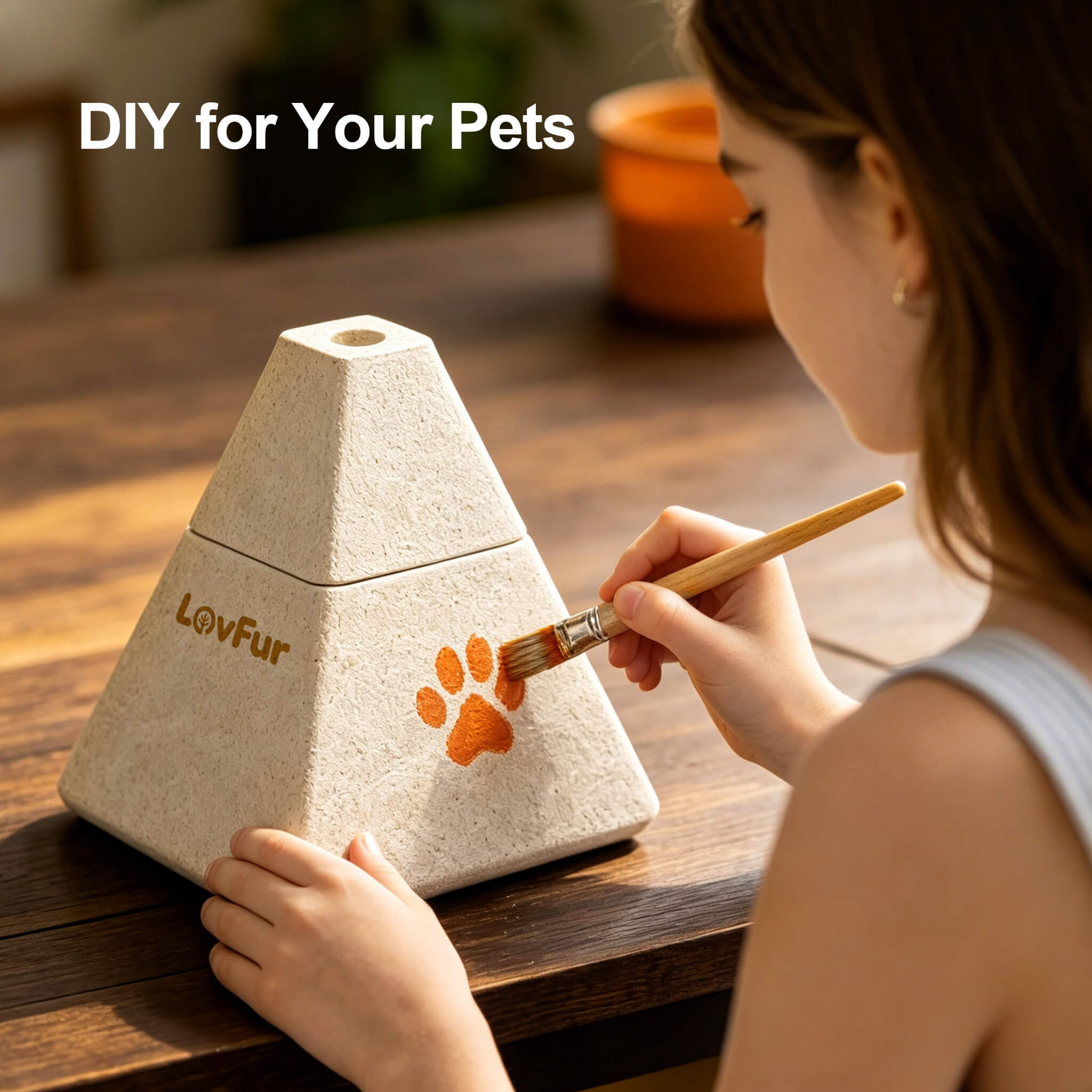 LovFur™ mycelium pet urn being hand-painted with a paw print, a biodegradable pet memorial urn for a personal farewell.